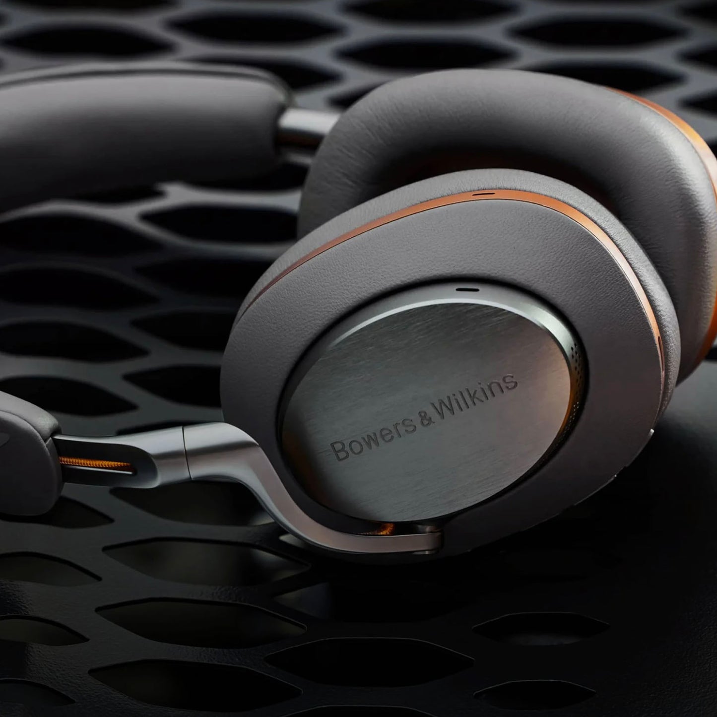 Bowers & Wilkins headphones on a dark textured background