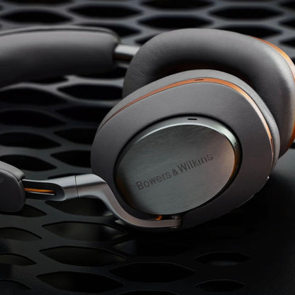 Bowers & Wilkins headphones on a dark textured background