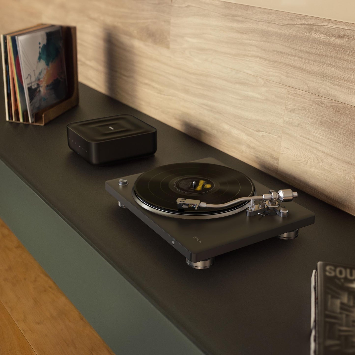 Turntable on a wooden shelf with records and a player.