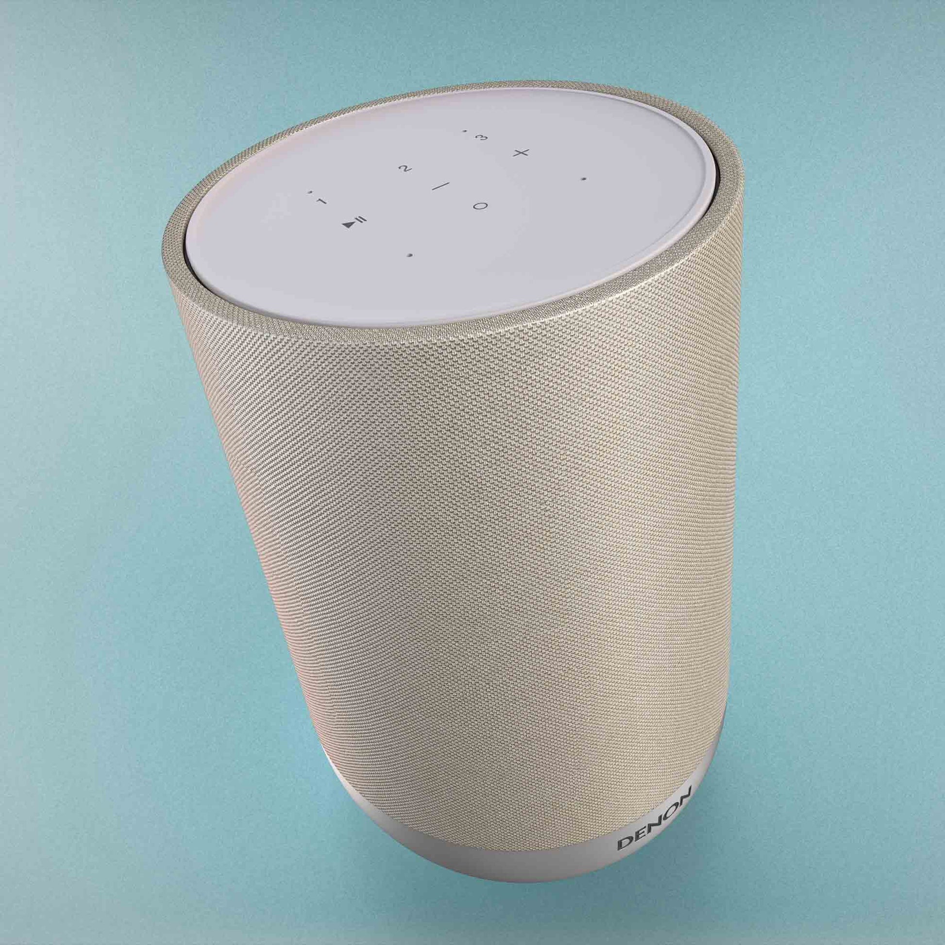 Denon Home 200 speaker with control panel on a light blue background