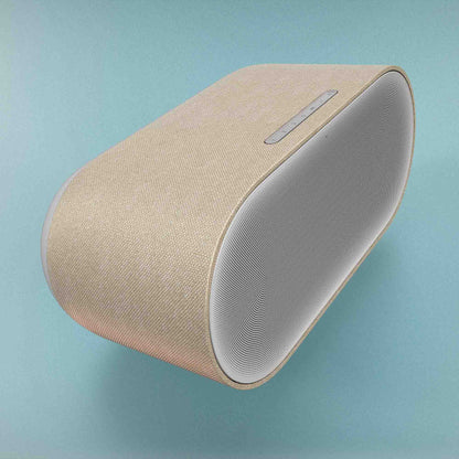 Denon Home 600 Wireless Speaker in white on blue background