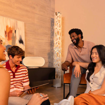 Group of people sitting together in a modern living room