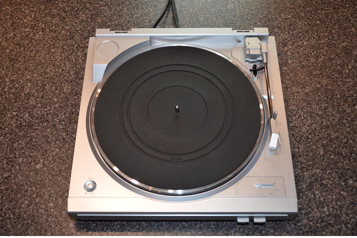 Turntable with platter and mat waiting to be removed.