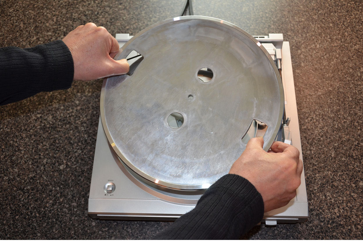 Step 2 - Remove platter making sure you disengage the old belt if it still exists. Clean off any residue from old belt.
