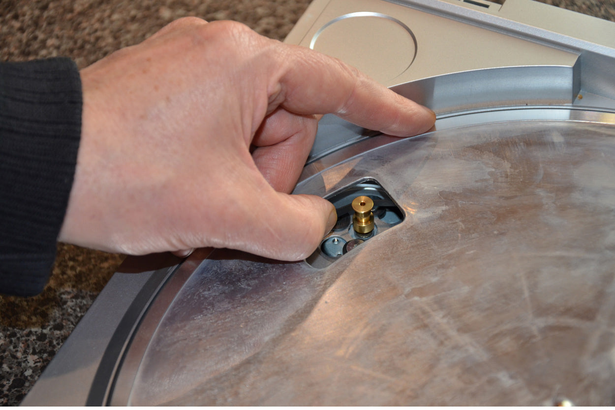 Step 5 - Grab hold of the belt and reinstall the platter making sure you refit the belt correctly over the motor spindle. Refit the mat and play, play, play!