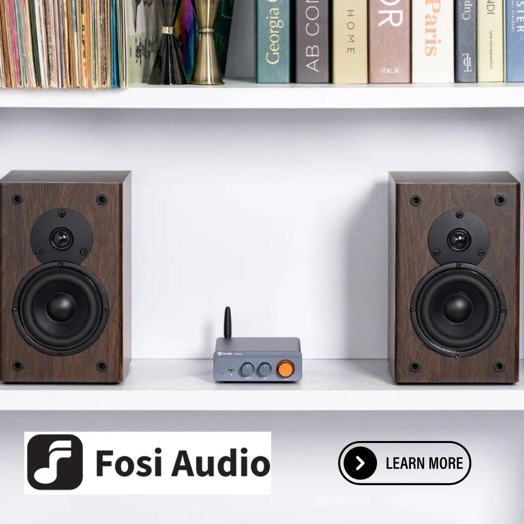 Fosi Audio speakers with a receiver on a shelf with books in the background