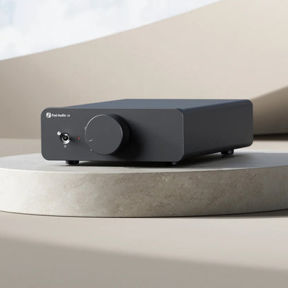 Fosi Audio Q6 Desktop DAC on stone bench