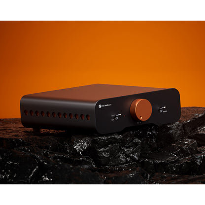 Fosi Audio ZA3 Balanced Stereo Amplifier on black surface and orange background