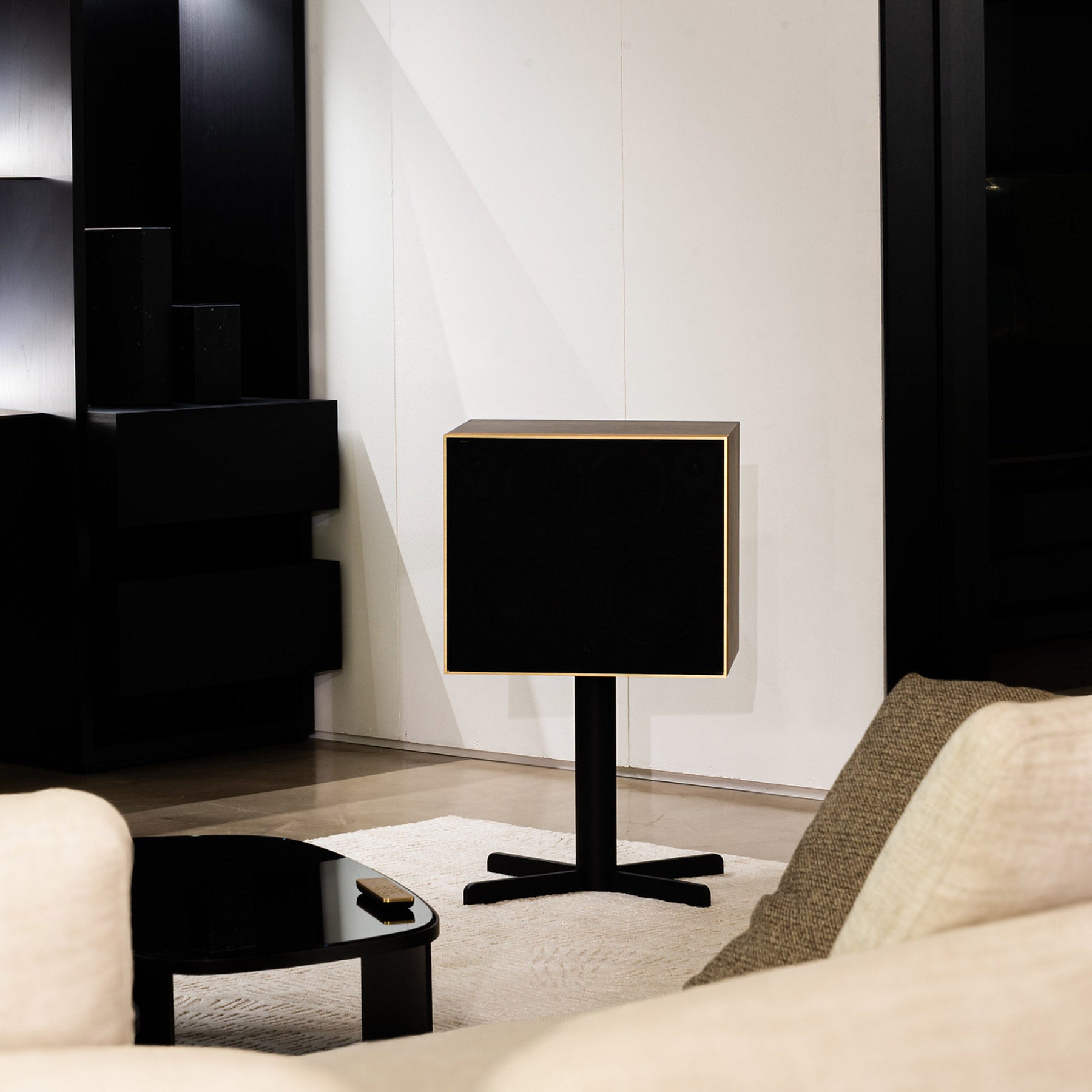Modern black DeCon/XL in a living room setting with neutral decor.