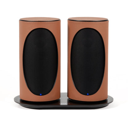 Pair of Geneva Duo Speakers in Cognac on charging cradle