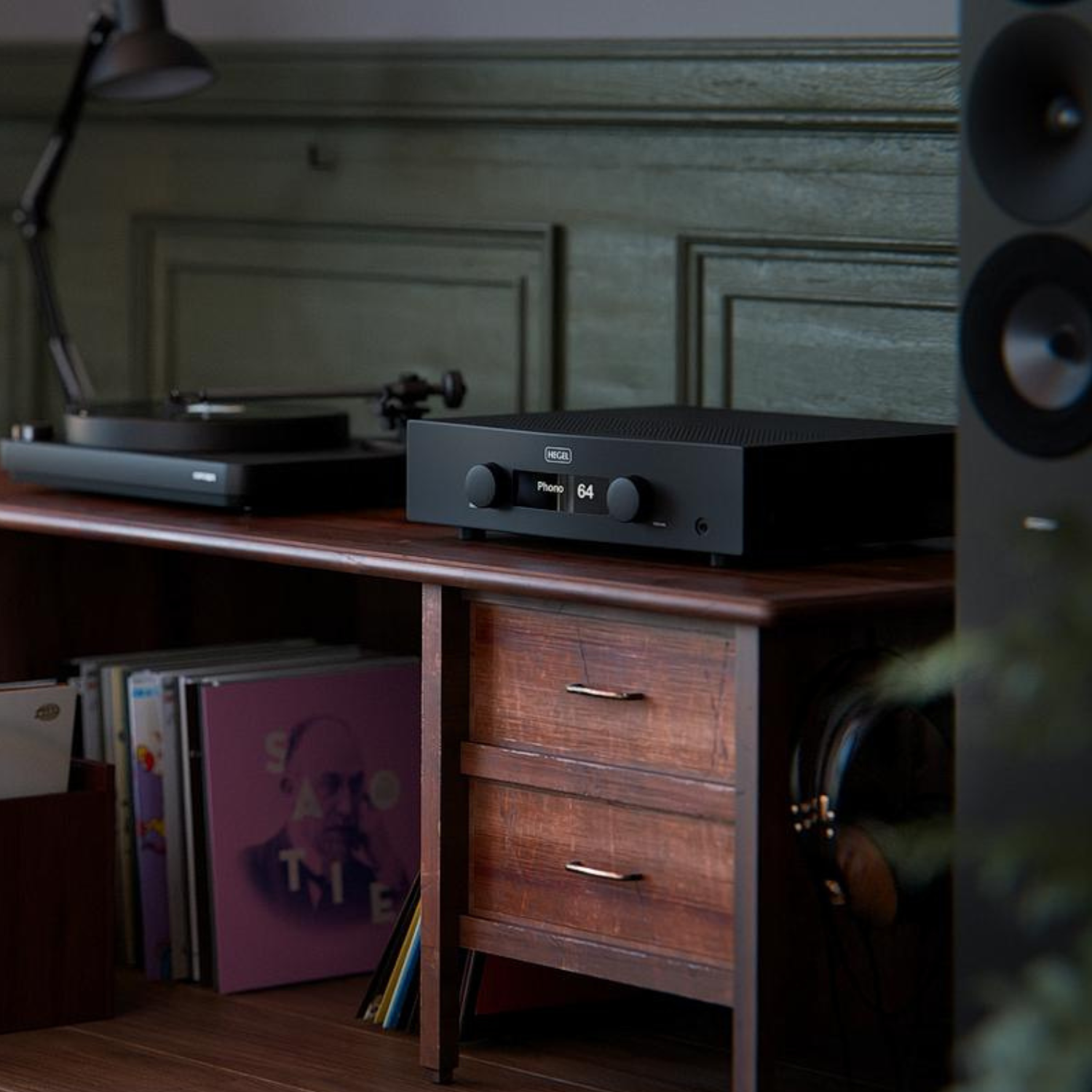 Lifestyle view of Hegel A200 Integrated Amplifier on timber cabinet next to turntable and speaker