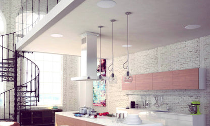 Kitchen with KEF Ci160CRDS Stereo In-Ceiling Speaker in roof and spiral staircase