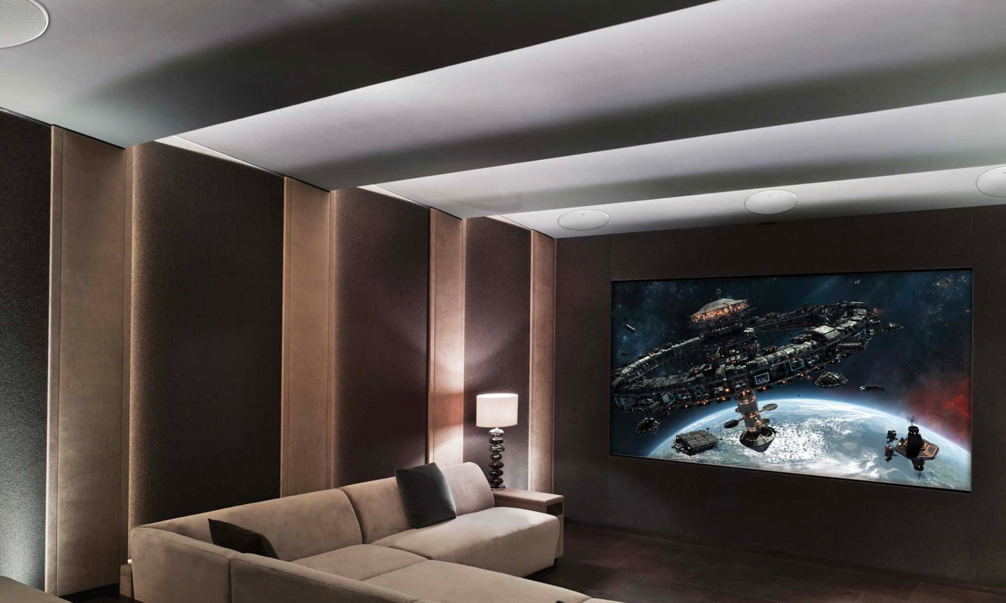 Modern cinema room with a large TV displaying a space-themed movie