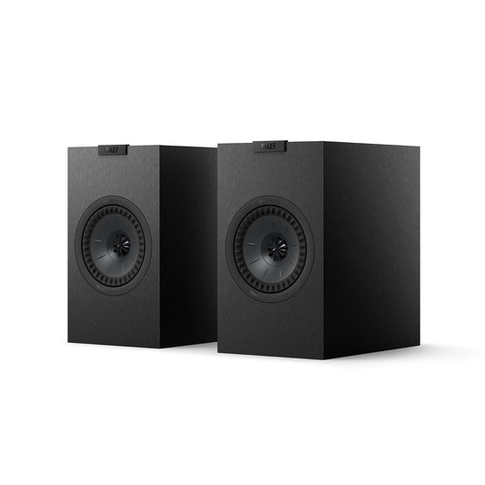 A pair of KEF Q1 Meta speakers in a black with a matte finish and visible driver units.
