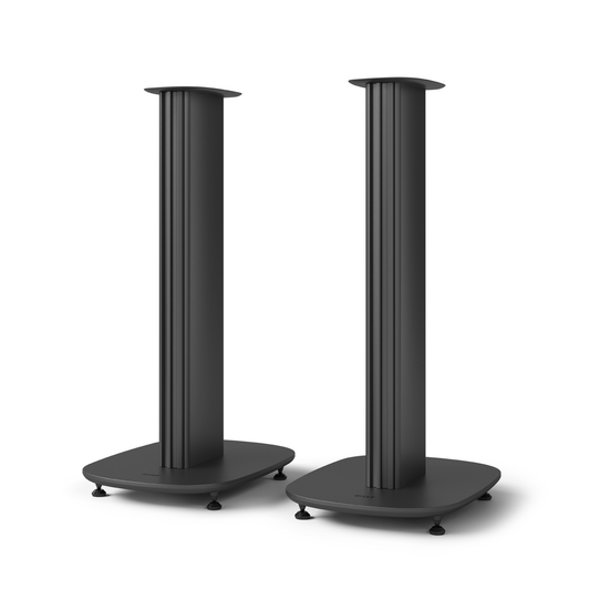 Two matching black speaker stand risers with slim vertical posts and wide square bases, shown on a clean white background.