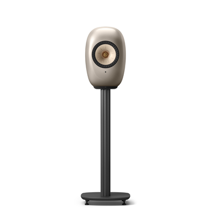 A modern floorstanding monitor speaker with a metallic champagne-gold oval cabinet and a dark gray stand on a white background.