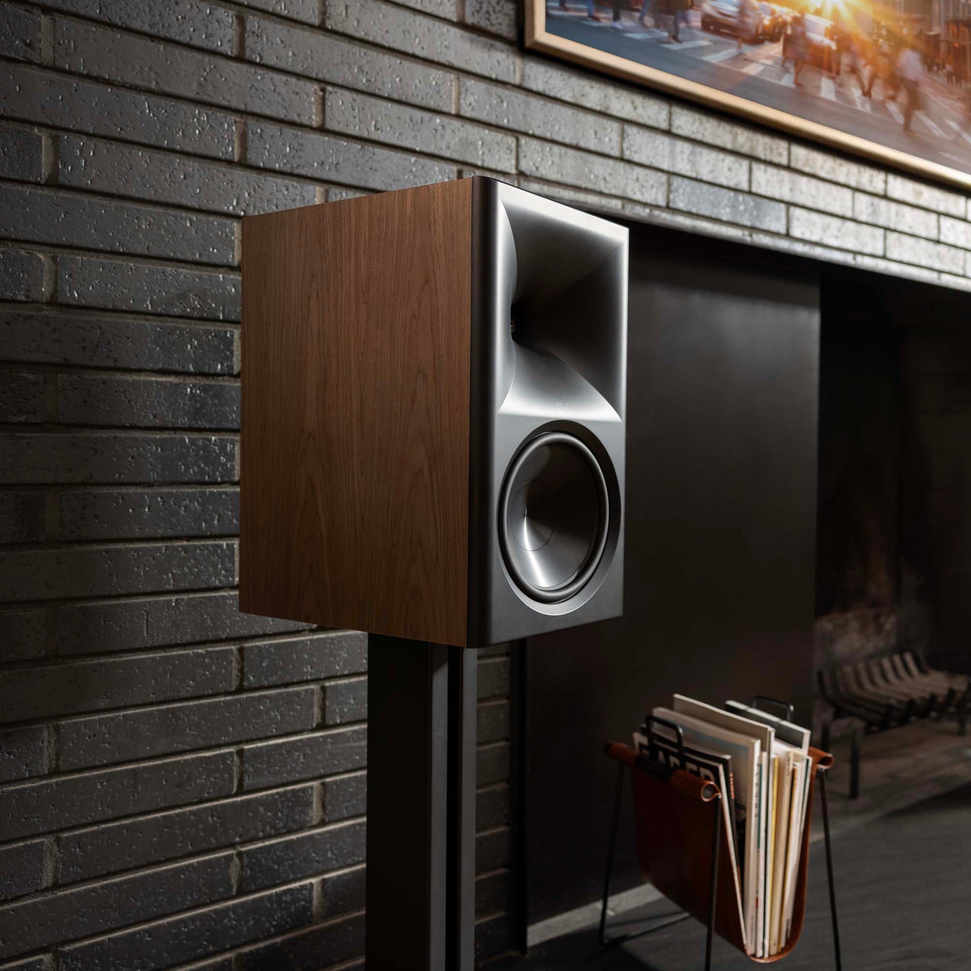 Wooden speaker mounted on a brick wall with a cozy room interior.