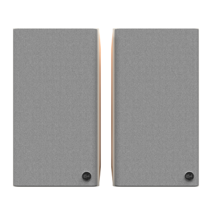 Front view of red oak Klipsch The Sevens II Powered Speakers on white background with grilles on