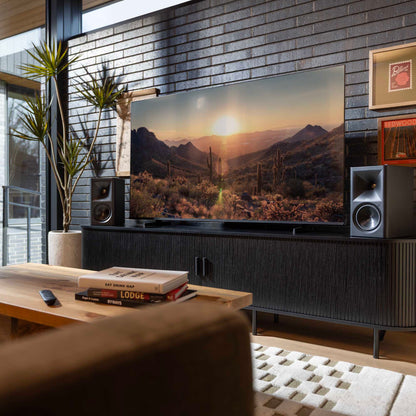 Klipsch The Fives II Powered Speakers on tv cabinet with tv