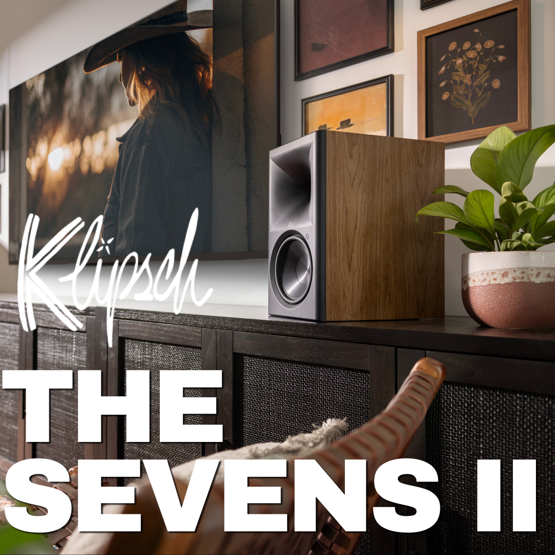Klipsch speaker on a shelf with decorative items and 'The Sevens II' text.