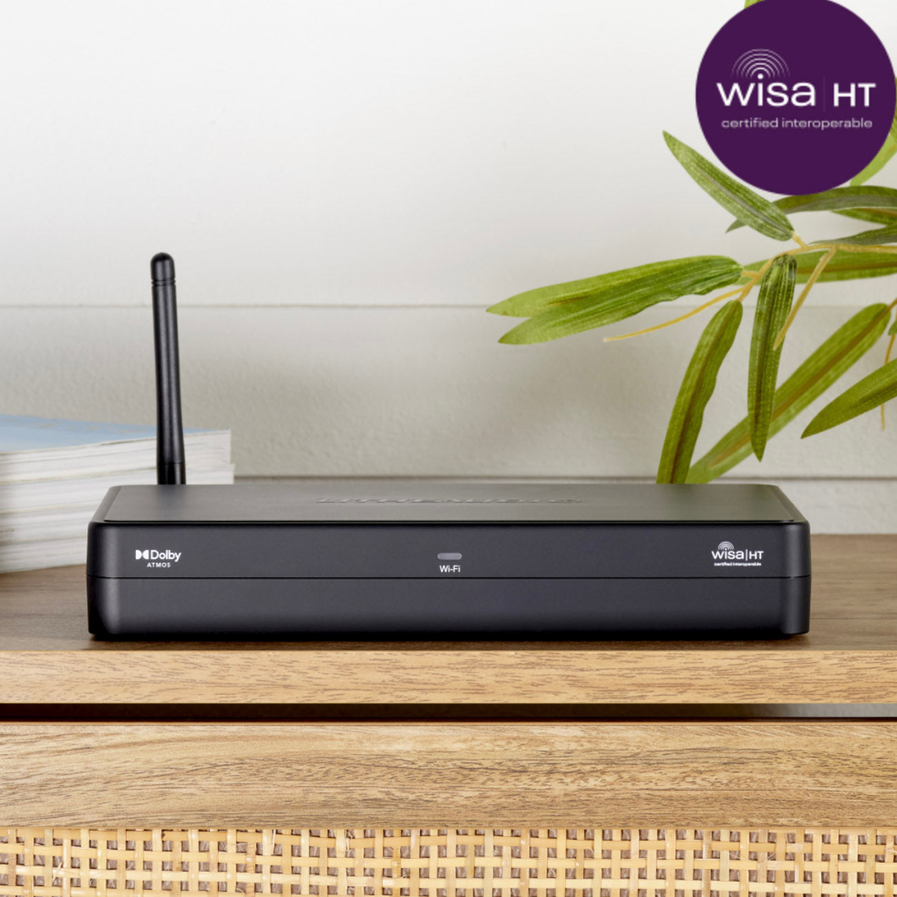 Black router on a wooden surface with a plant and Wisa HT logo in the background