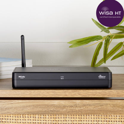Black router on a wooden surface with a plant and Wisa HT logo in the background