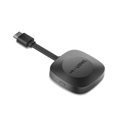 Black electronic device with USB-C cable on a white background, featuring the Loewe brand.