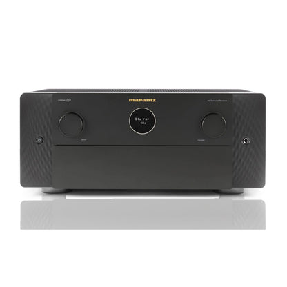 A black Marantz Cinema 40 8K Home Theatre Amplifier with a front panel display, volume knobs, and input selection controls.