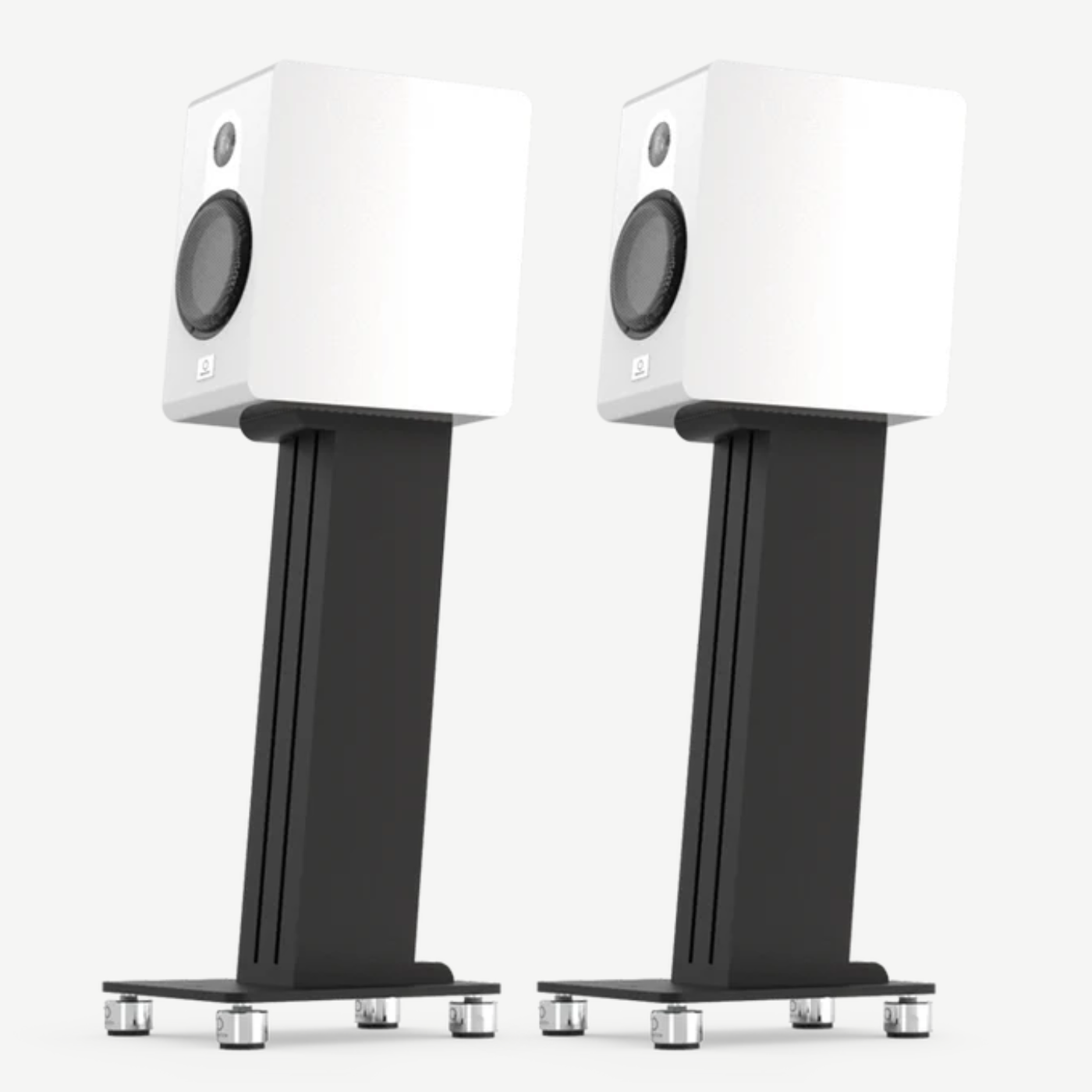 Pair of white Marten Parker Duo Bookshelf Speakers on black stands against a white background