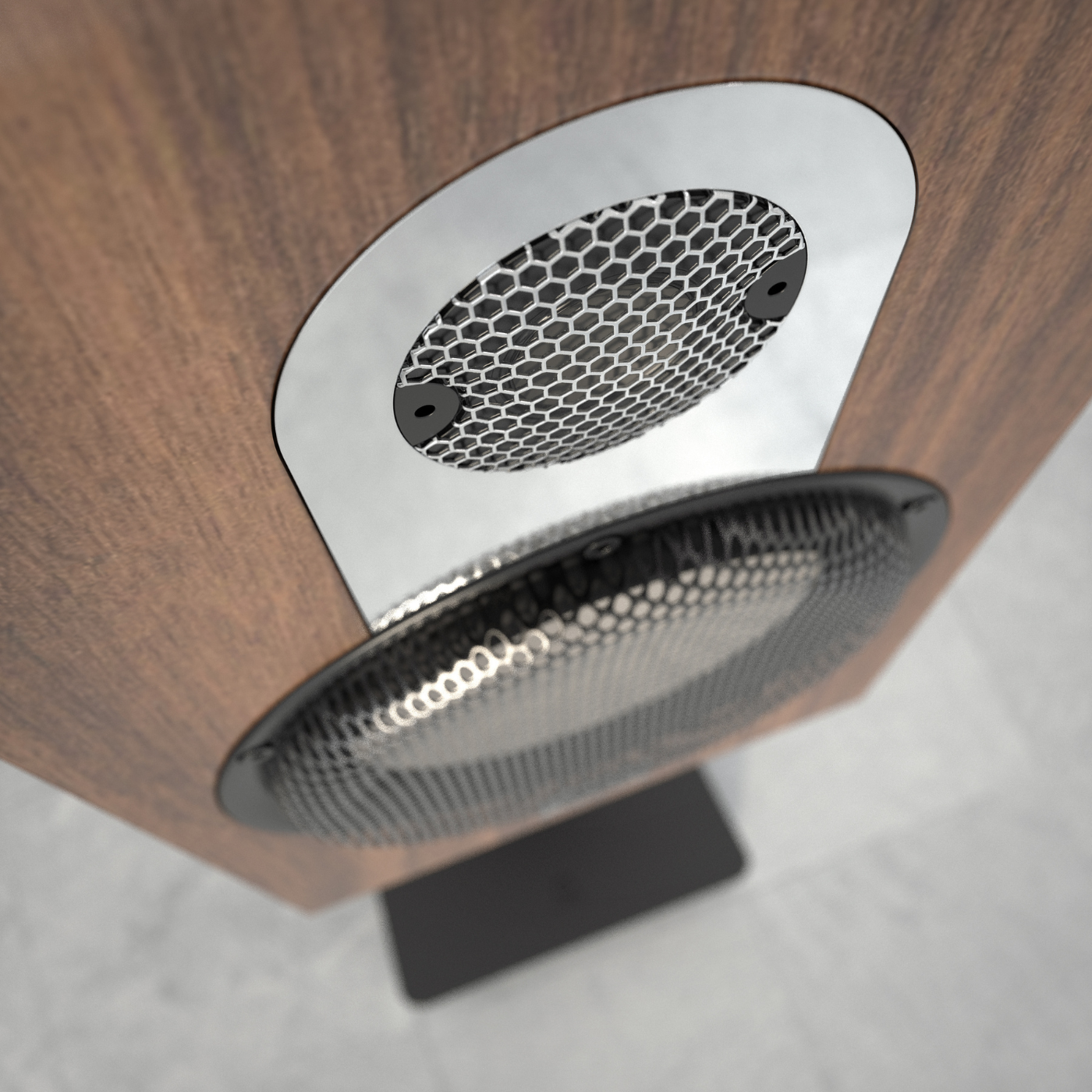 Close-up of a wooden speaker with metal grille on a gray background