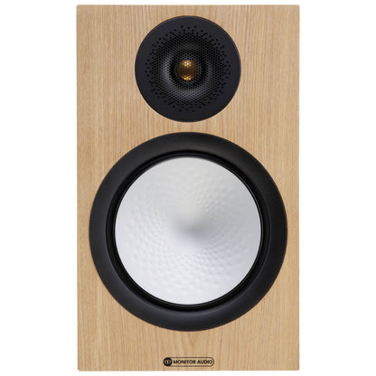 Monitor Audio speaker with wooden finish and black grille on a white background