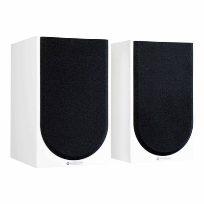 Pair of white speakers with black grilles on a white background