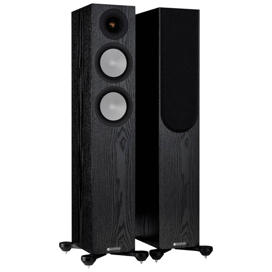 Pair of black floor-standing speakers on a white background