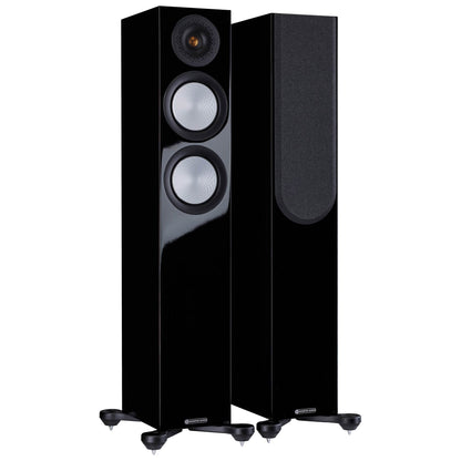 Pair of black floor-standing speakers on a white background