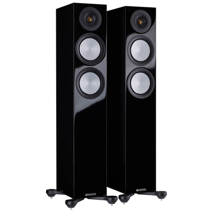 Pair of black floor-standing speakers on a white background