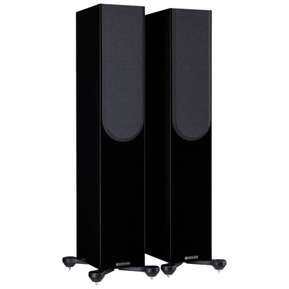 Pair of black floor-standing speakers on a white background