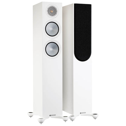 White floor-standing speakers on a white background
