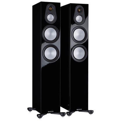 Pair of black floor-standing speakers on a white background