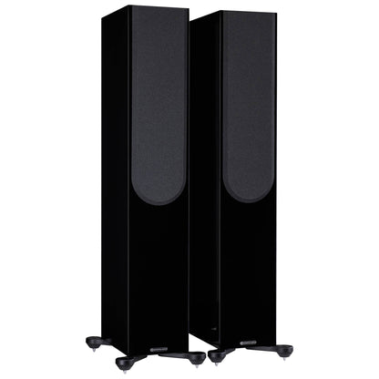 Pair of black floor-standing speakers on a white background