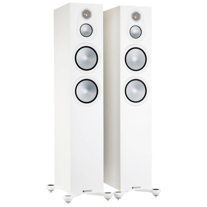 Pair of white floor-standing speakers on a white background