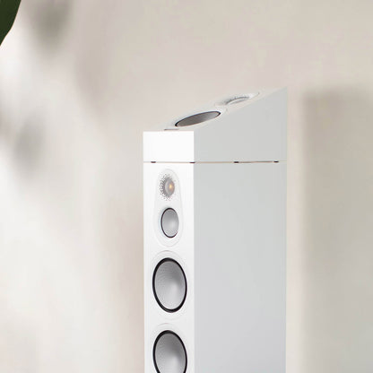 Monitor Audio Silver AMS 7G in white on top of floorstanding speaker