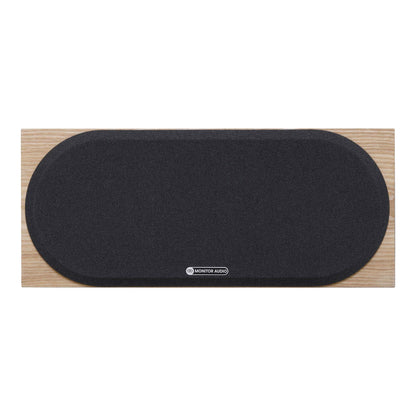 Black speaker grille on a wooden frame with Monitor Audio logo