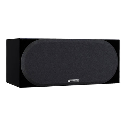 Black center channel speaker on a white background
