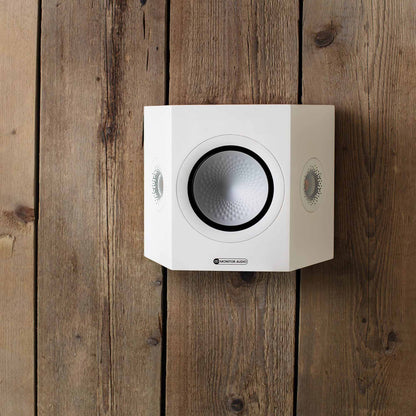 White speaker on a wooden wall
