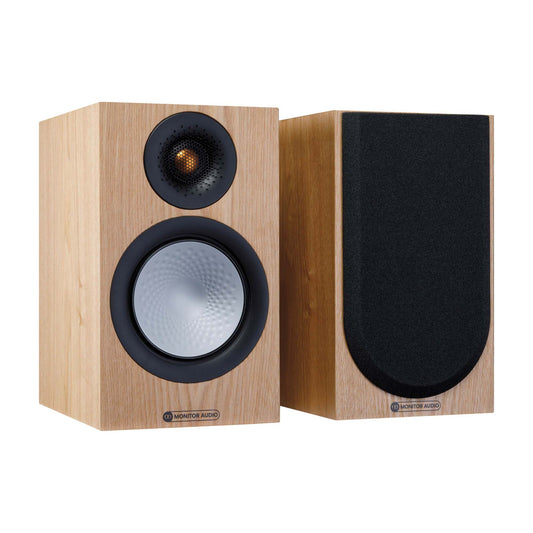 Pair of wooden speakers with black grilles on a white background