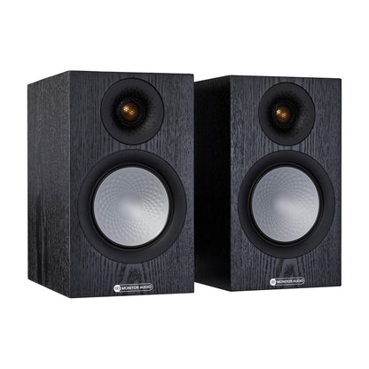 Pair of black speakers with visible brand logo on a white background