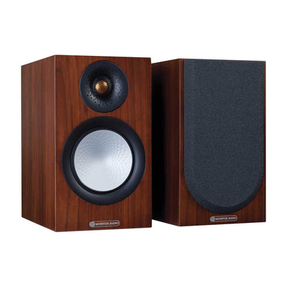 Pair of wooden speakers with black grills on a white background