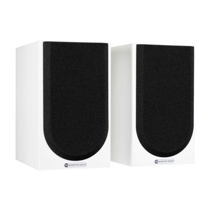 Pair of white speakers with black grilles on a white background