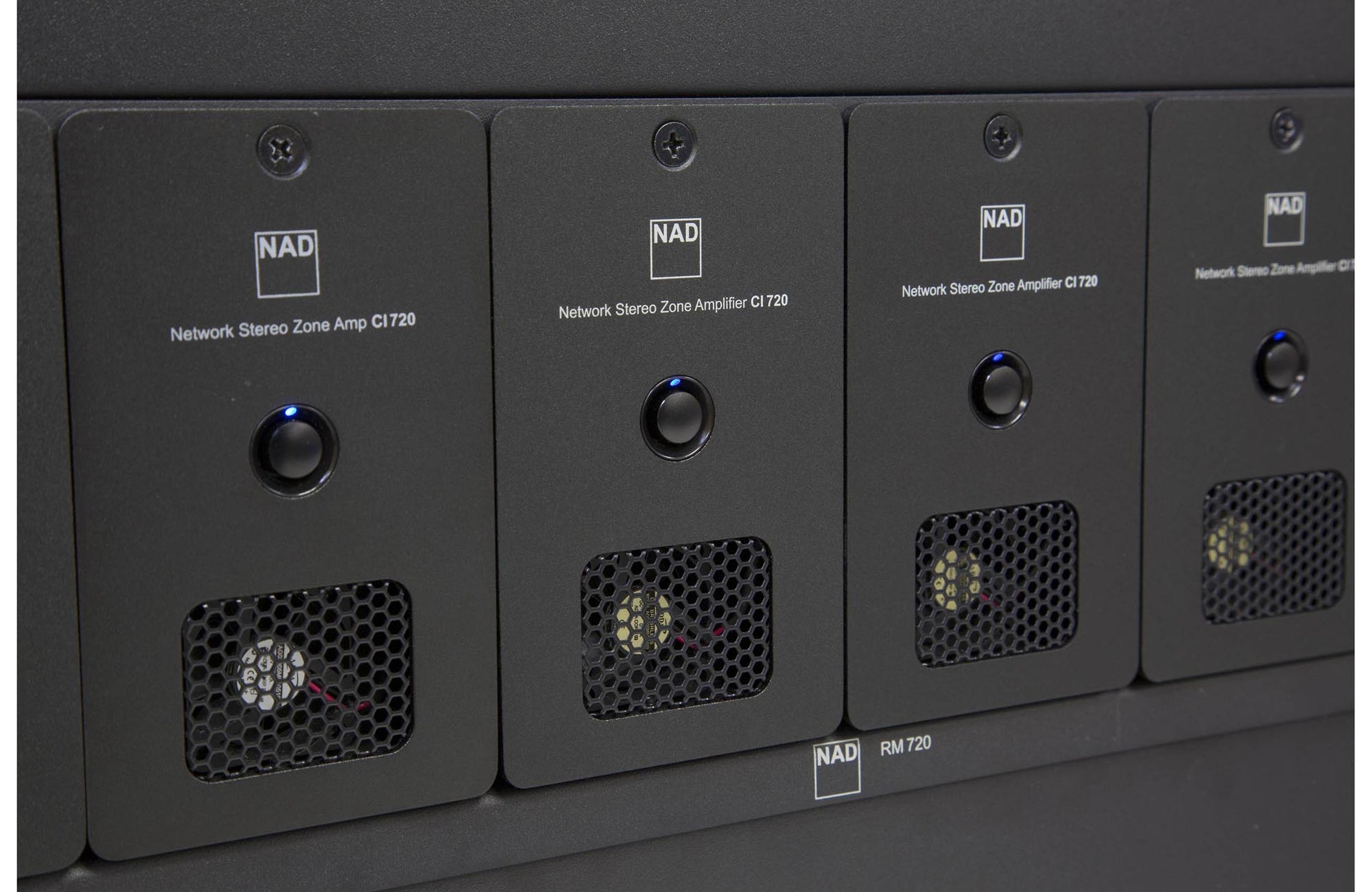 Row of NAD C720 amplifiers with visible branding.