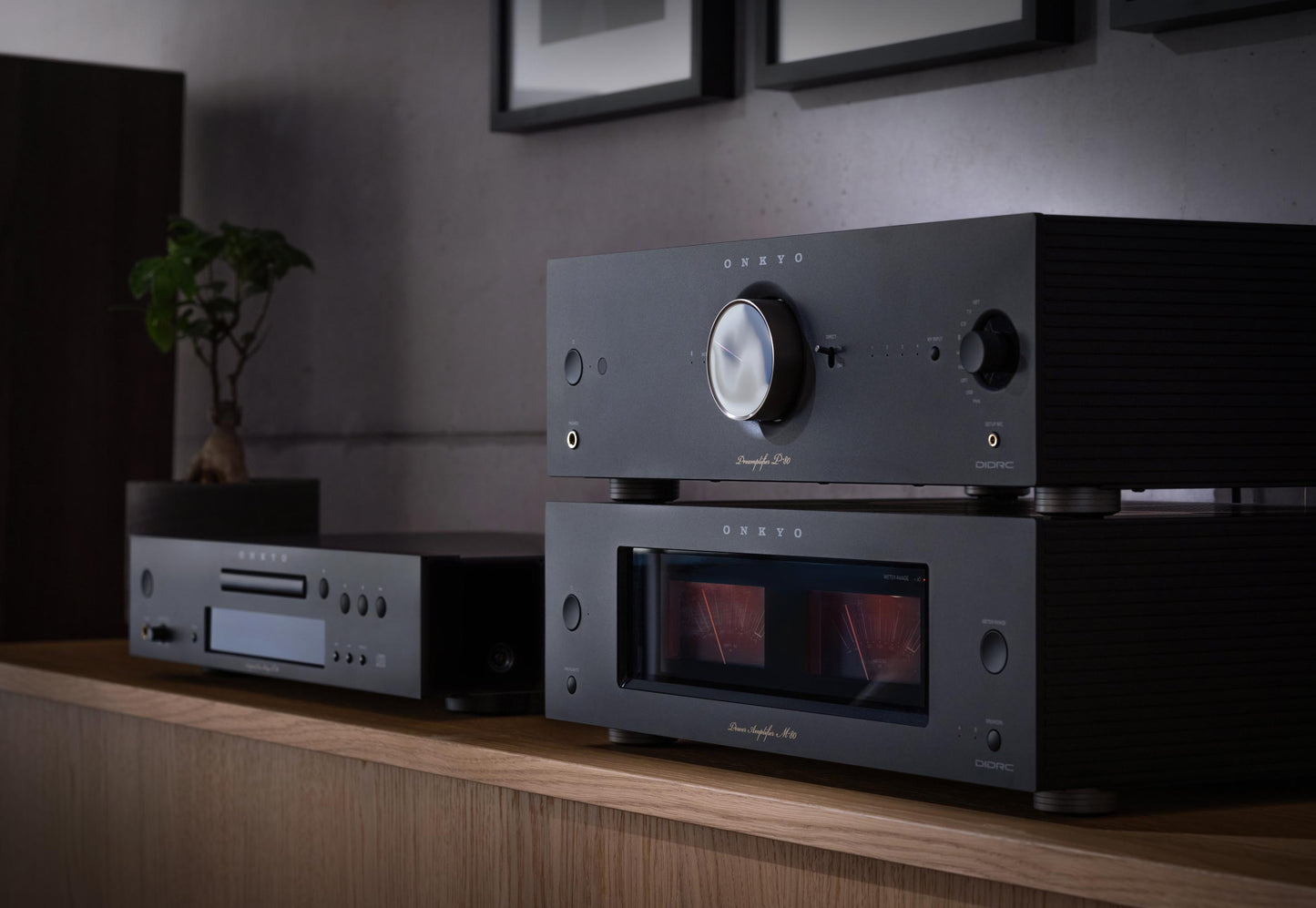 Audio equipment on a wooden shelf with a dark background